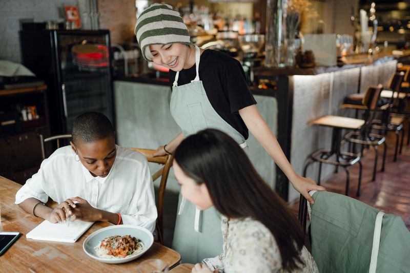 Waitress serving customers in a restaurant