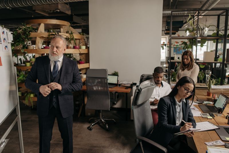 Team meeting in a modern office with greenery