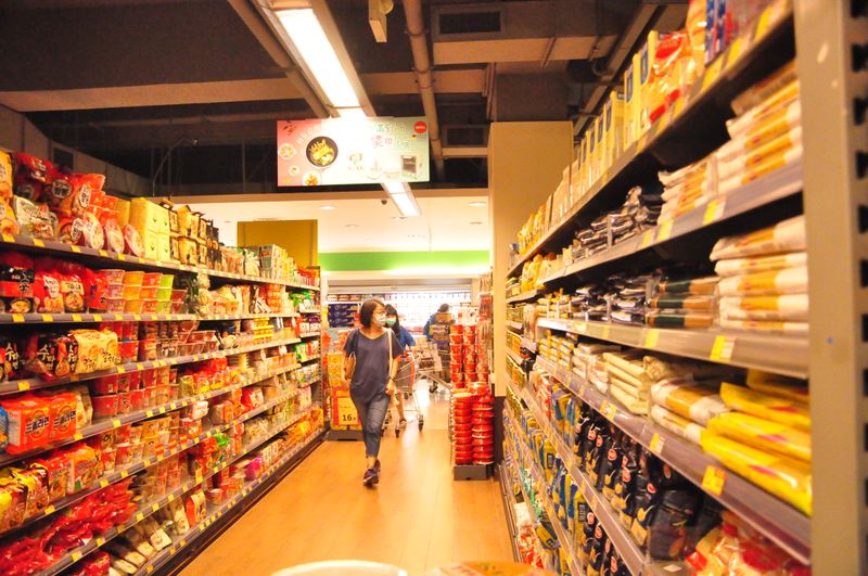 Shoppers browsing a retail store aisle